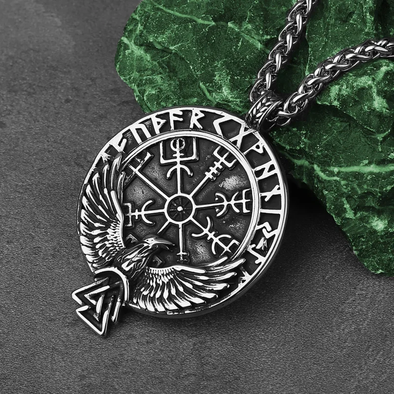 The Viking Rune Crow Pendant Chain Necklace features Viking runes, a central Vegvisir symbol, and an eagle with outstretched wings above a Valknut—a striking Norse design.