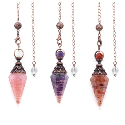 Three ornate pendulum necklaces feature pink, purple, and orange pointed resin crystal pendants filled with natural chips, hanging from bronze chains—ideal for Reiki Healing, Yoga, or as 7 Chakra Crystal Pendulums for dowsing and divination.