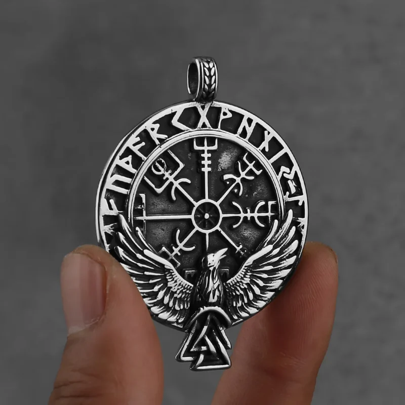 The Viking Rune Crow Pendant Chain Necklace features Viking runes, a central Vegvisir symbol, and an eagle with outstretched wings above a Valknut—a striking Norse design.