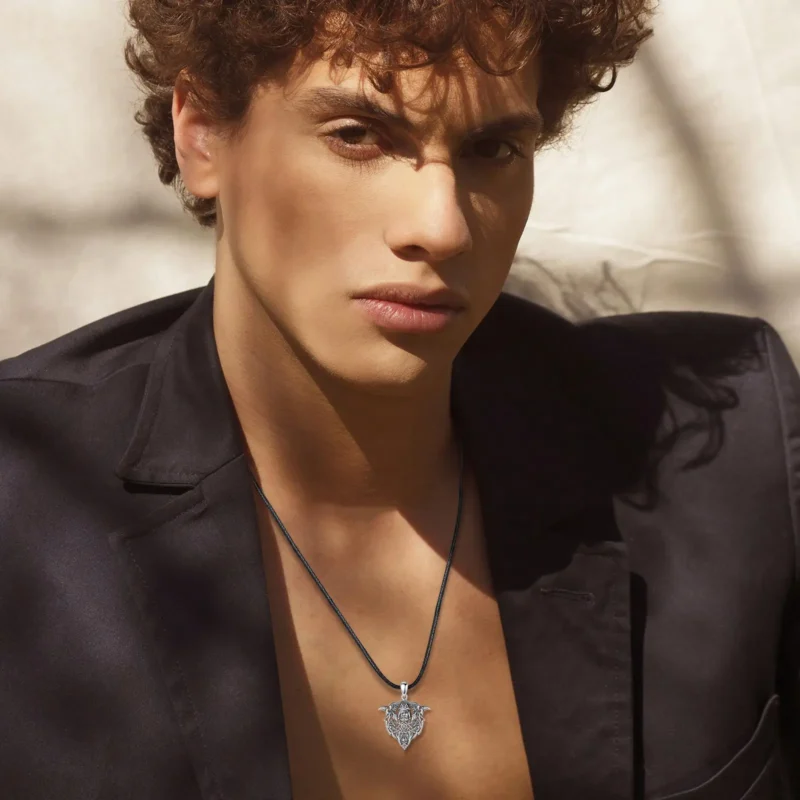 The Eudora 925 Sterling Silver Viking Raven Wolf Necklace for Men showcases a detailed Nordic Odin warrior skull pendant with Norse symbols and ravens, hanging on a black cord—an ideal personality jewelry gift.