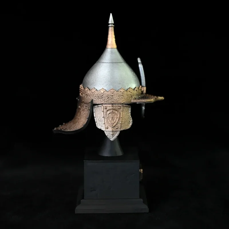 The Miniature Ancient Arabian Warrior Helmet features a pointed top and gold accents, displayed on a black pedestal with its full height marked as 135mm